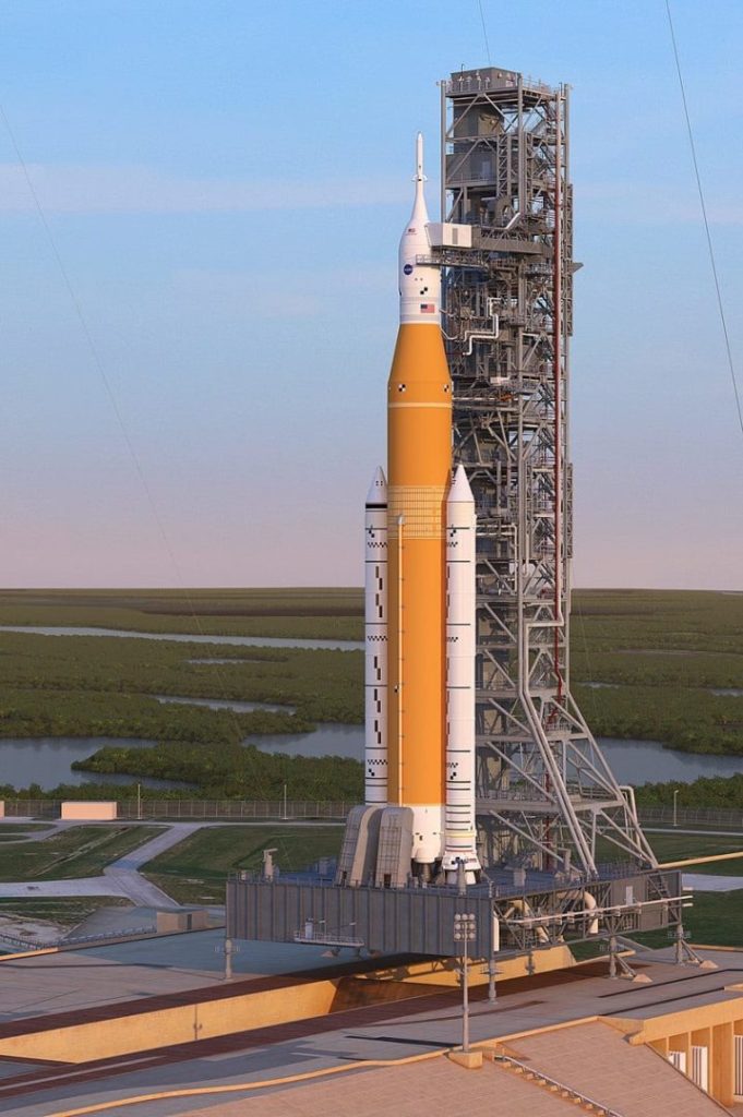 An artist's rendering of SLS Block 1 (core stage in orange) with the Orion spacecraft and Launch Abort System sitting atop it. Courtesy of NASA.