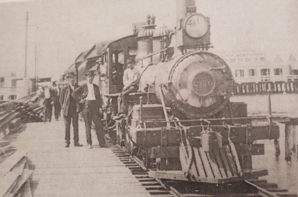 The Pontchartrain Railroad and Smoky Mary, circa 1900 and operating since 1831. View from a pier at Milneburg. Photographs taken from The Streetcars of New Orleans by Louis C. Hennick, © Louis C. Hennick, used by permission of the publisher, Pelican Publishing.