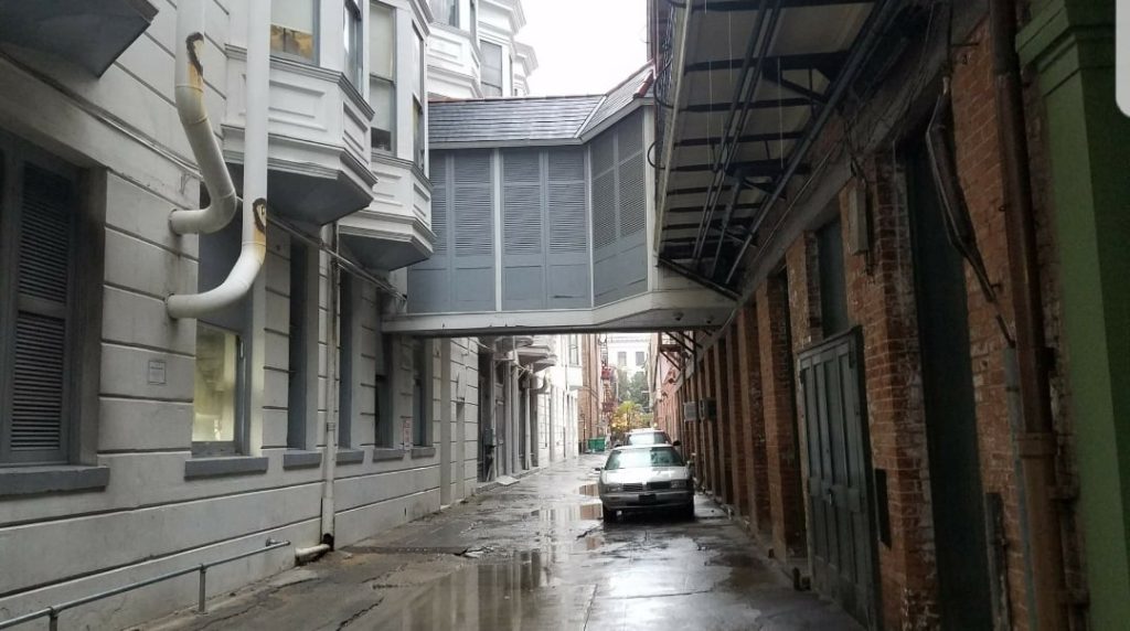 Between Iberville and Bienville streets, the once bustling Exchange Place is used for little more than parking and trash cans.